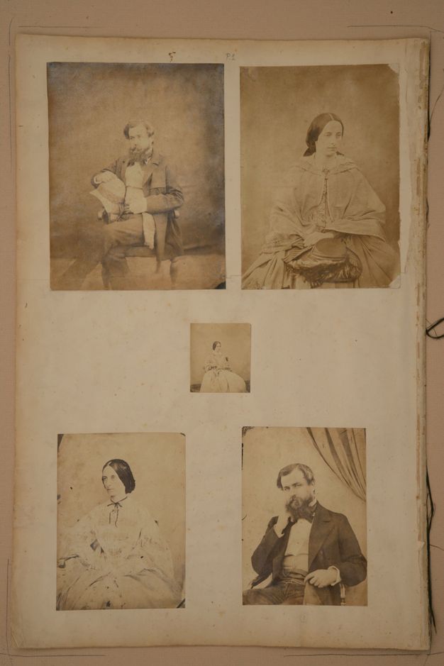 Page of a book. Among five black and white studio portraits, a bearded man wearing a suit appears twice, each time next to a different photograph of a woman. A fifth, smaller picture of a woman is at the centre.